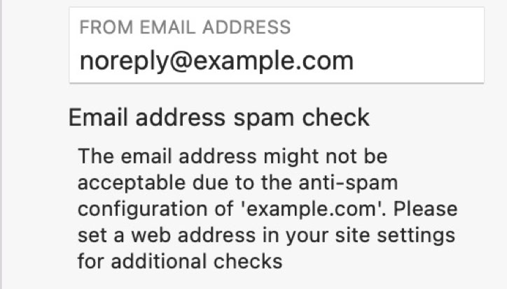 Email spam check warning for "noreply@example.com" with instructions to set a web address for additional checks.